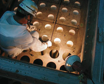 Installation step 2 — hold-down seated on the flange and nuts tightened