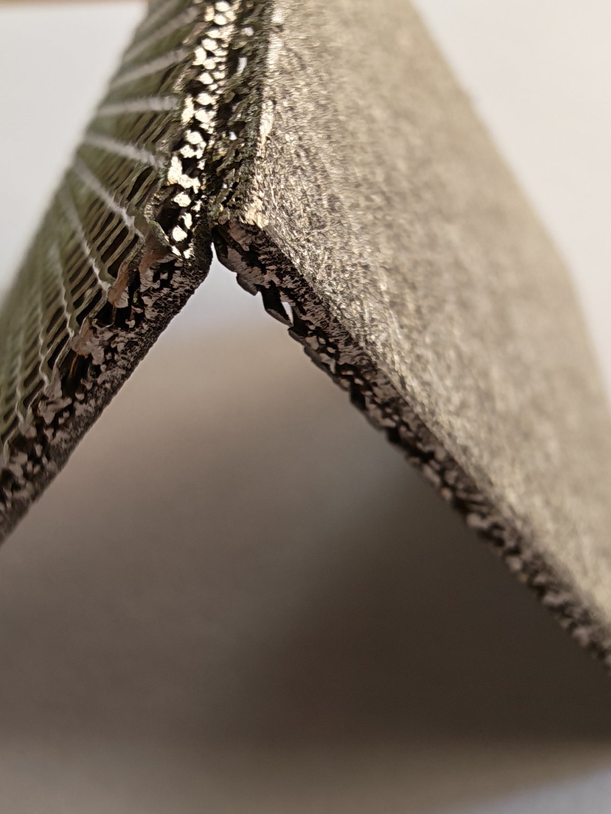 Composite nickel fiber felt thickness and folded edge